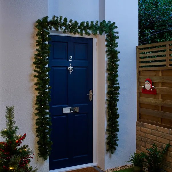 The garland offers a festive touch to any door