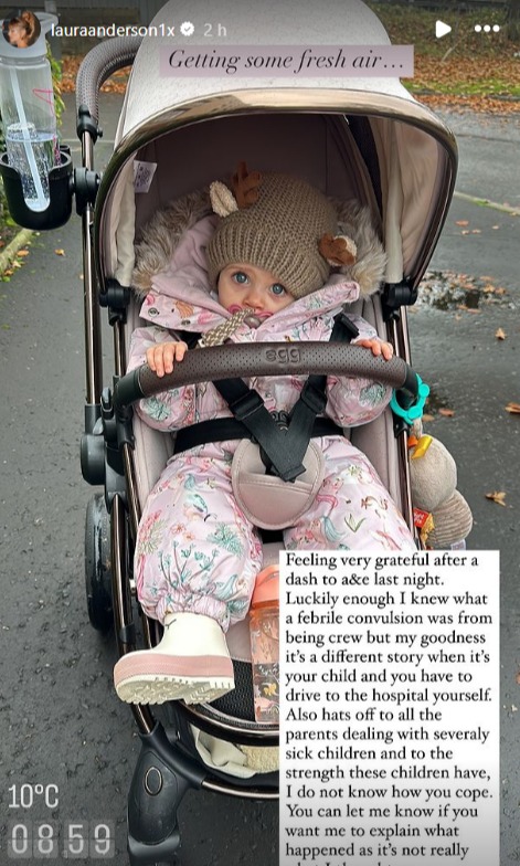 a baby is sitting in a stroller and the temperature is 10 degrees celsius