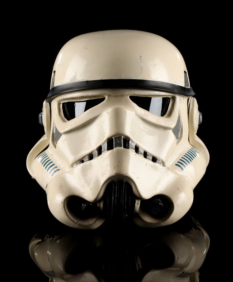 a close up of a storm trooper helmet on a black background