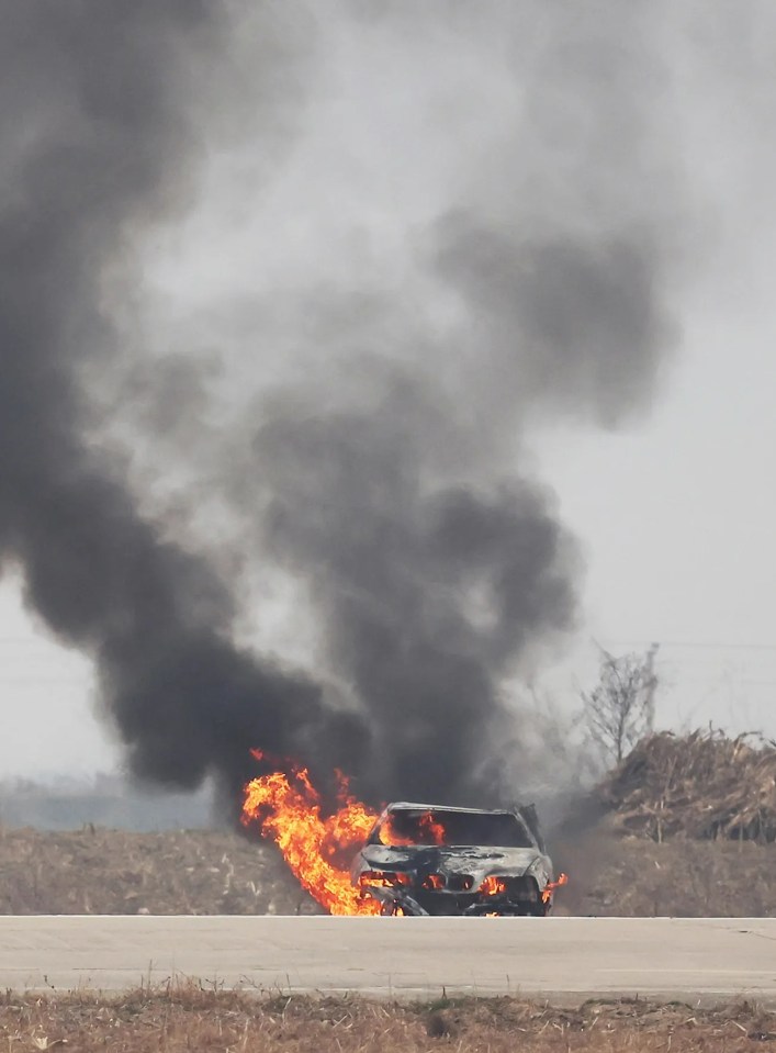 The old BMW turned into a massive flame ball after it is struck by the drone