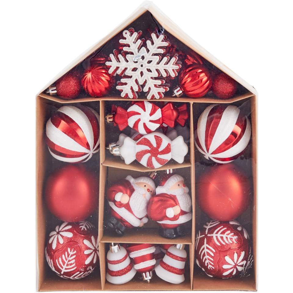 a box filled with red and white christmas ornaments