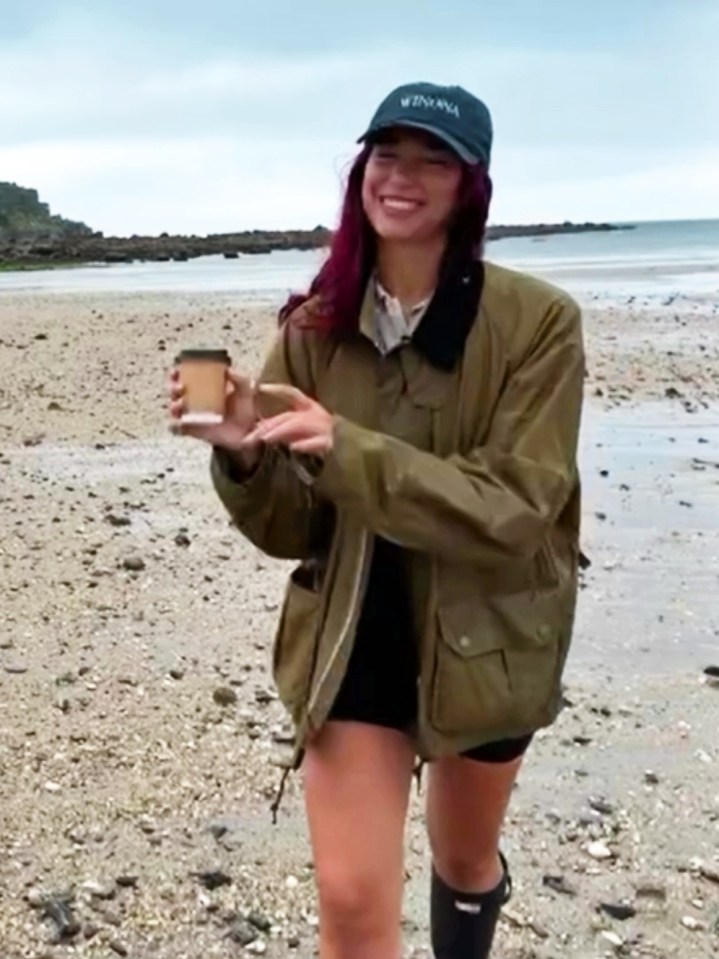 Dua Lipa chooses Barbour for the posh farmer look for a stroll on the beach