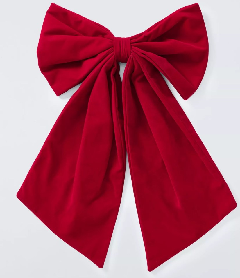 a red velvet bow on a white background