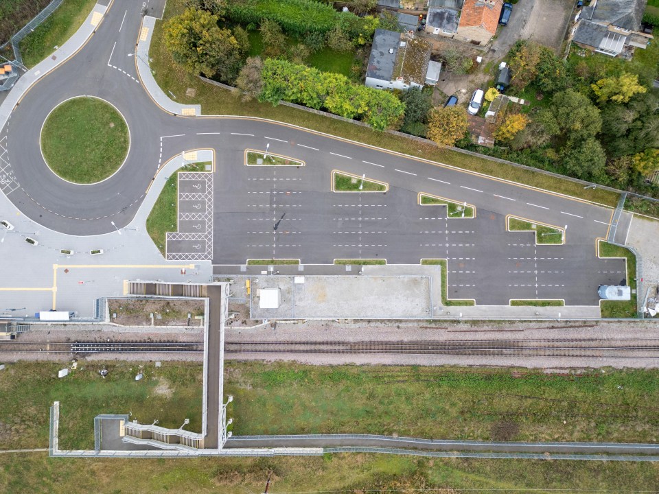 an aerial view of a parking lot and a roundabout