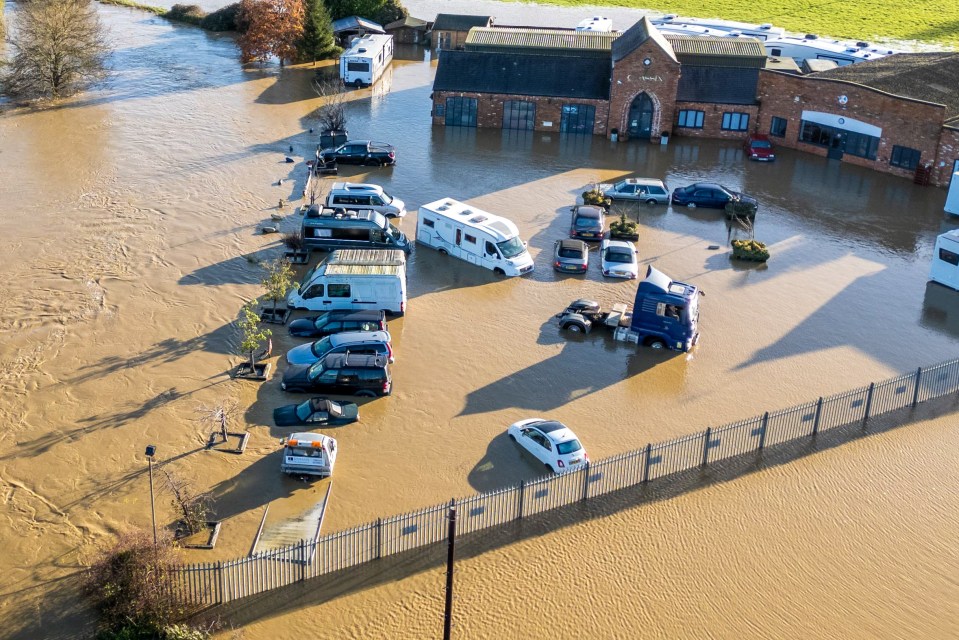 Cars underwater at a garage at Billing Aquadrome in Northampton this morning