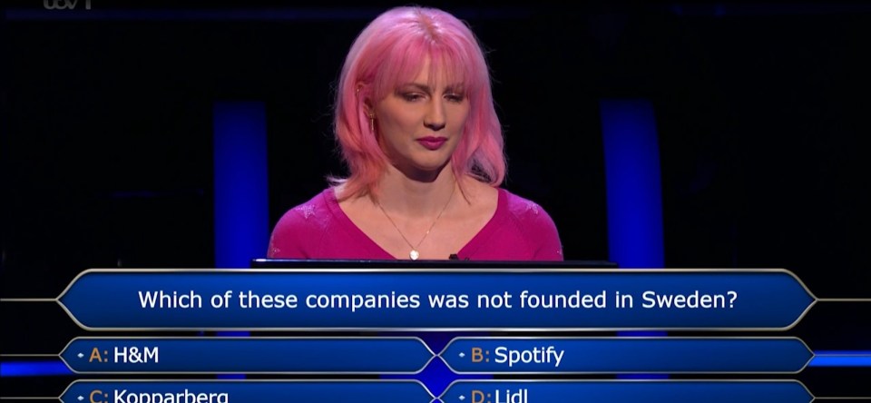 a woman with pink hair is answering a question about which of these companies was not founded in sweden