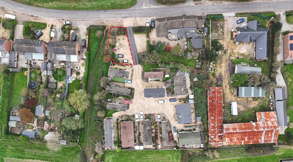 an aerial view of a residential area with a red line showing the location of a house