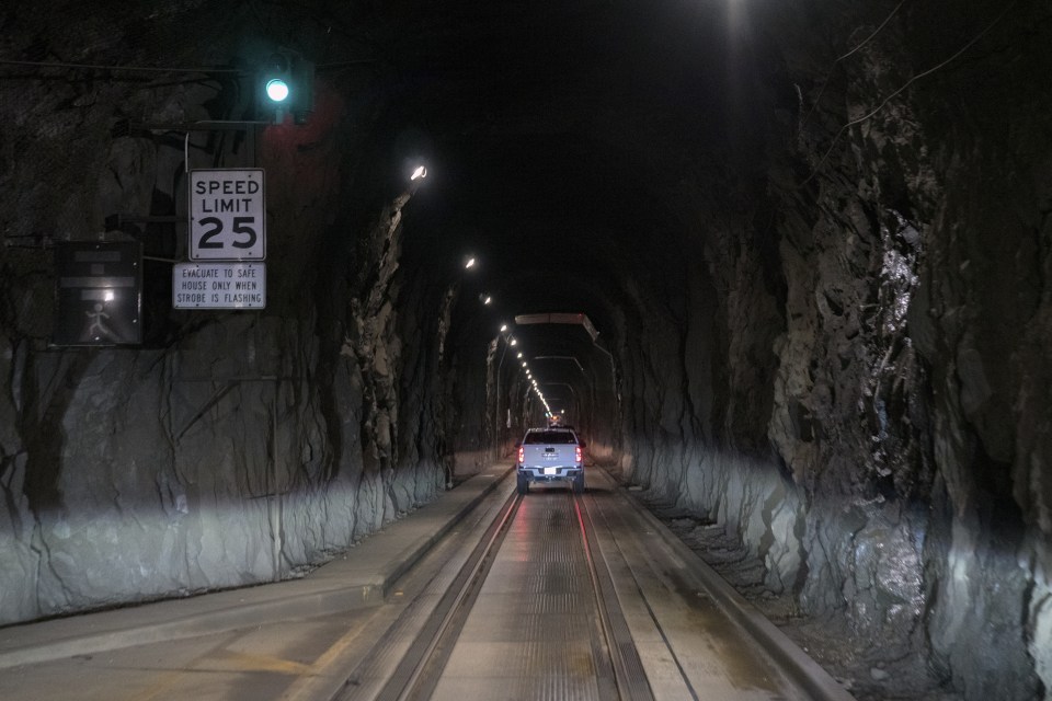 ALASKA, UNITED STATES - MAY 29: A view of the tunnel, where passage is only possible through a one-way tunnel that is closed at night at Whittier town in Alaska, United States on May 29, 2024. All citizens of the town of Whittier, located 100 kilometers south of Alaska, live in a building called Begich Towers, which was formerly used as a military barracks. Gathering all the elements of a small town in one place, Begich Towers includes not only houses but also a police station, doctor's office and school. (Photo by Hasan Akbas/Anadolu via Getty Images)