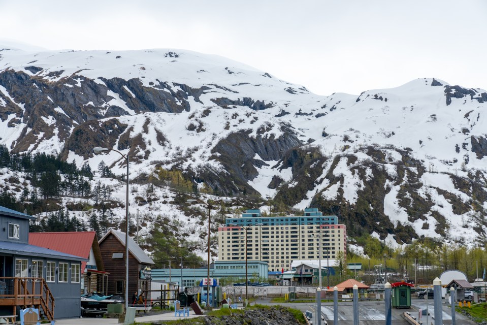 ALASKA, UNITED STATES - MAY 29: A general view of the Begich Towers, which brings together all the elements of a small town in one place, includes a police station, a doctor's office and a school, and where the town's citizens live in Whittier town, where passage is only possible through a one-way tunnel that is closed at night, Alaska, United States on May 29, 2024. All citizens of the town of Whittier, located 100 kilometers south of Alaska, live in a building called Begich Towers, which was formerly used as a military barracks. (Photo by Hasan Akbas/Anadolu via Getty Images)