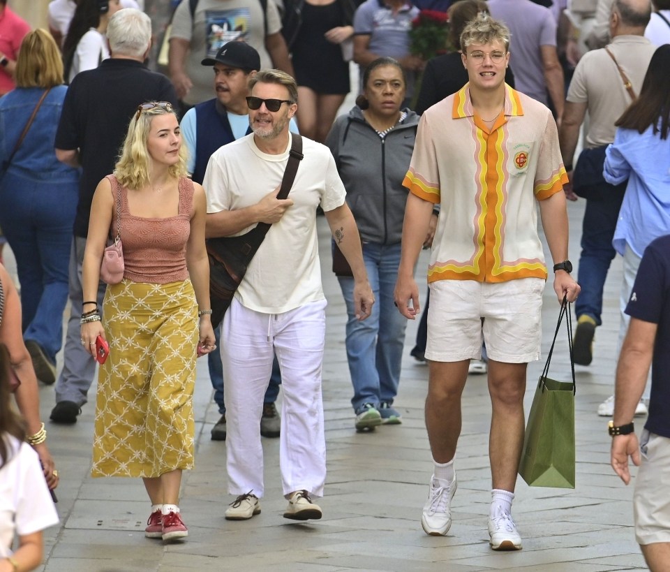 BGUK_2751212 - Venice, ITALY - *PREMIUM-EXCLUSIVE* - MUST CALL FOR PRICING BEFORE USAGE - Take That star Gary Barlow enjoys a family vacation out in the Italian sunshine of Venice.....Gary was seen taking a stroll with his son, Daniel Barlow who towers above his father, standing 6 foot 2 tall and with Daniel's girlfriend as they took in the sights of the old historical city with a few selfie snaps along the way.....The gang enjoyed their little sightseeing trip before meeting up with Gary's wife Dawn Andrews to enjoy a spot fine Italian dining as Dawn was pictured sporting an injury and wearing a sling after reportedly had broken her wrist. *PICTURES TAKEN ON THE 14/10/23*....Pictured: Gary Barlow - Daniel Barlow....BACKGRID UK 14 NOVEMBER 2023 ....BYLINE MUST READ: Cobra Team / BACKGRID....UK: +44 208 344 2007 / uksales@backgrid.com....USA: +1 310 798 9111 / usasales@backgrid.com....*Pictures Containing Children Please Pixelate Face Prior To Publication*