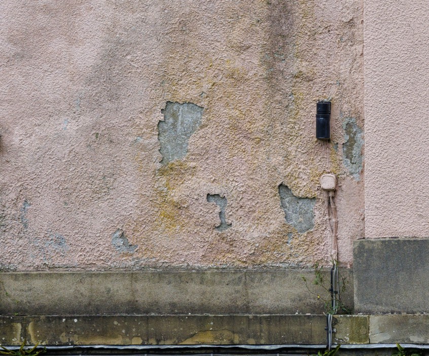 The outside walls are mouldy and crumbling away