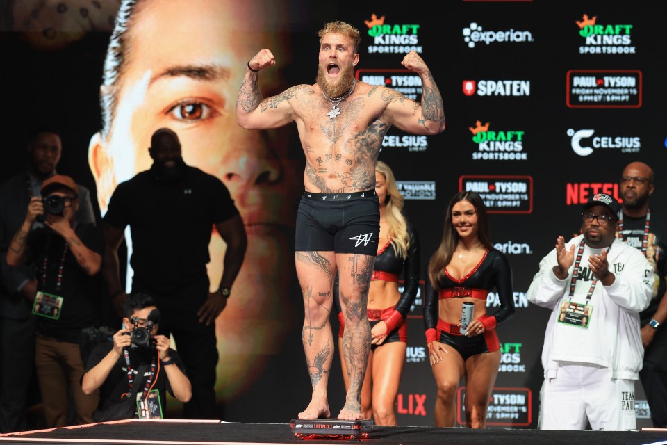 IRVING, TEXAS - NOVEMBER 14: Jake Paul poses on the scale during his ceremonial weigh-in at The Pavilion at Toyota Music Factory on November 14, 2024 in Irving, Texas. Paul will meet Mike Tyson in a heavyweight bout on November 15 at AT&T Stadium in Arlington, Texas. (Photo by Christian Petersen/Getty Images)