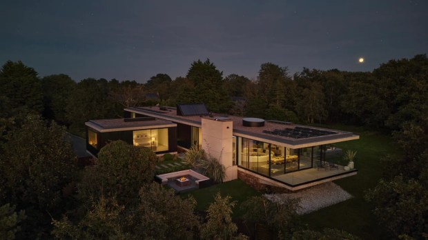 a modern house with solar panels on the roof