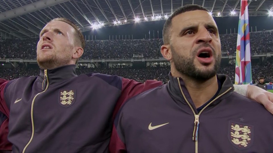 two men wearing nike jackets stand next to each other