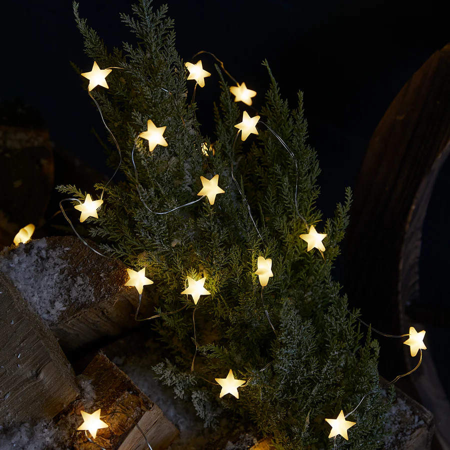 a christmas tree with a string of stars on it