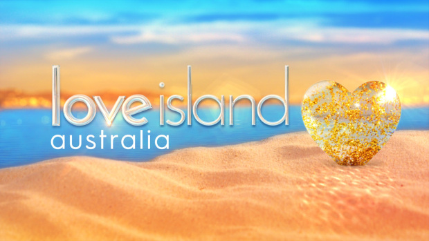 a poster for love island australia with a heart in the sand