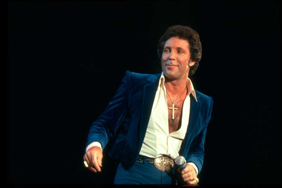 Tom Jones performing on stage in 1984