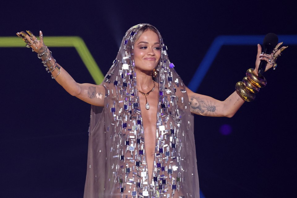 Rita Ora made a jaw dropping entrance to the MTV EMAs in a sheer nude sequin cloak