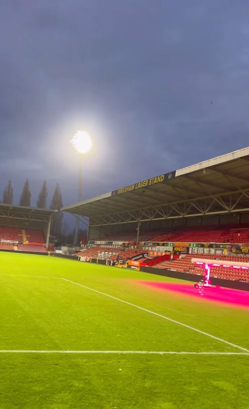 a soccer field with a sign that says wolfram lager stand