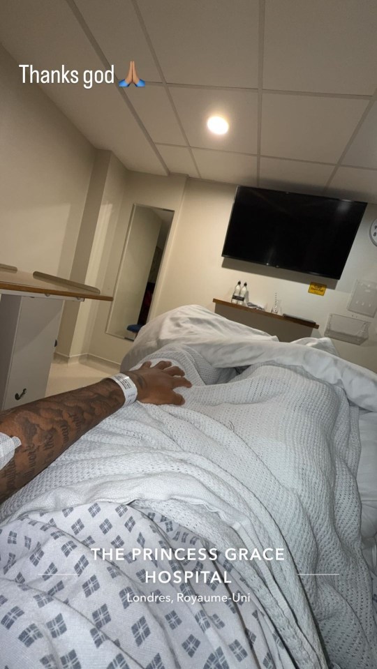 a man is laying in a hospital bed with the words thanks god above him