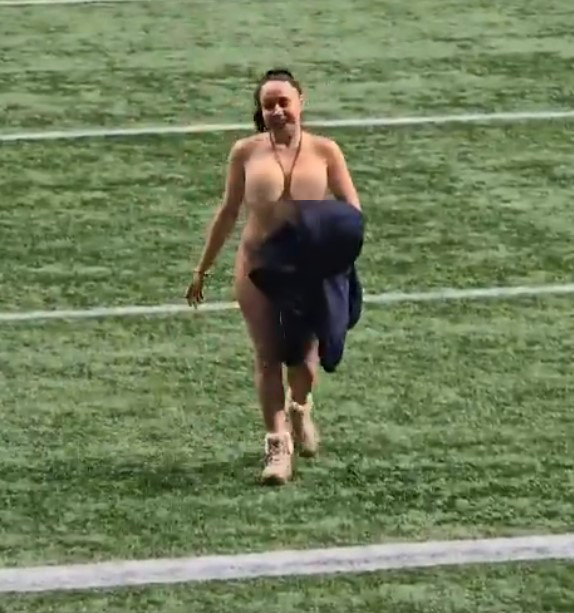 The woman stunned fans by casually walking on the pitch