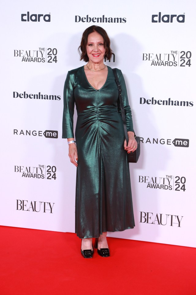 Arlene Phillips wore a shiny emerald green dress