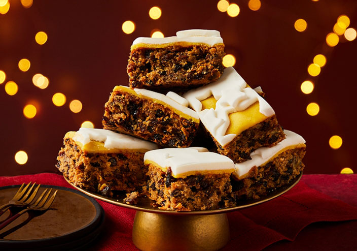 a stack of slices of cake on a gold plate