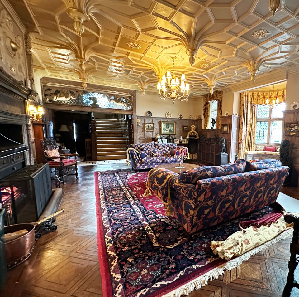 a living room filled with furniture and a fireplace