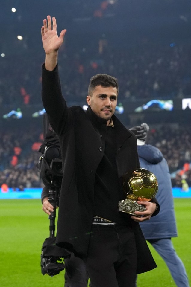 Manchester City's Rodri with the Ballon d'Or trophy before the Premier League match at the Etihad Stadium, Manchester. Picture date: Saturday November 23, 2024. PA Photo. See PA story SOCCER Man City. Photo credit should read: Martin Rickett/PA Wire. RESTRICTIONS: EDITORIAL USE ONLY No use with unauthorised audio, video, data, fixture lists, club/league logos or "live" services. Online in-match use limited to 120 images, no video emulation. No use in betting, games or single club/league/player publications.