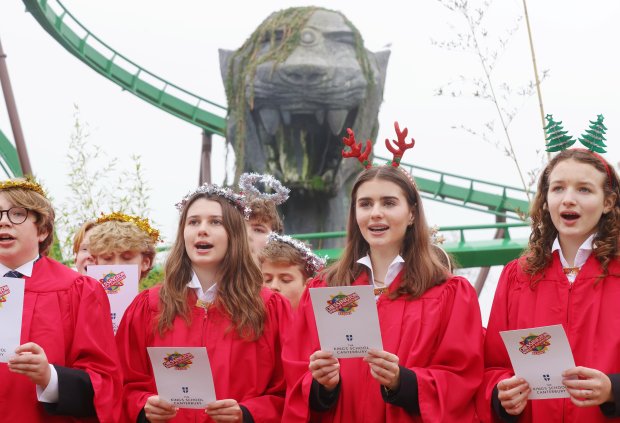 The Crypt Choir of The Kings School Canterbury rehearses for an extreme carol concert, 66ft up in the air on Chessington World of Adventures' Mandrill Mayhem rollercoaster. The choir will launch Chessington's Christmas event, Winter's Tail, on 23 November. Photo released November 14 2024. Christmas carols are seeing a resurgence in popularity  thanks to Gen Z.A study of 2,000 adults who celebrate the festive season found 85 per cent either enjoy hearing or singing carols during December.But its Gen Z who claim to be the biggest fans (90 per cent), with 29 per cent saying hearing the music reminds them of their time at school.While 43 per cent said it helps them remember fond memories with their friends and family..