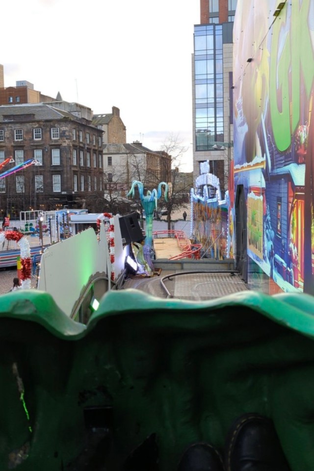 Grinch ride at Glasgow Christmas markets takes patrons past signage from the animated Grinch film on the outside. Release date November 27 2024. I spent £5 trying the viral Grinch ride at Glasgow Christmas markets dubbed "the new Willy Wonka rip off." The ride went viral earlier this week, after one mum's TikTok highlighting the ride garnered nearly 10,000 views - with commenters shocked at the lacklustre experience, which featured "Primark jumpers and socks" and "Home Bargains decor." It drew multiple comparisons to the summer's Willy Wonka experience - which used AI advertisements and saw families cough up £35 per ticket, only to be greeted by a nearly empty warehouse filled with cheap decor. After spotting the posts online describing families' disappointment at "The Grinch Christmas Adventure" at St. Enoch's square, I was intrigued to see what the ride could have in store.