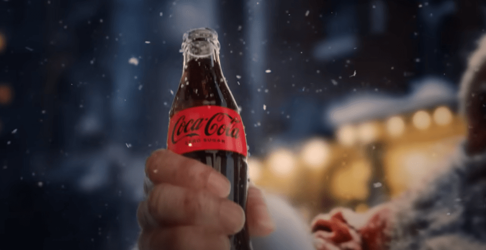 A hand reaching out with a bottle of Coke Zero is generated by AI