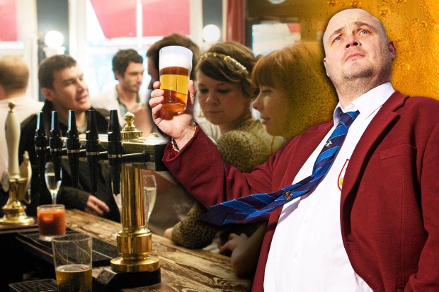 a man in a red jacket is pouring a glass of beer