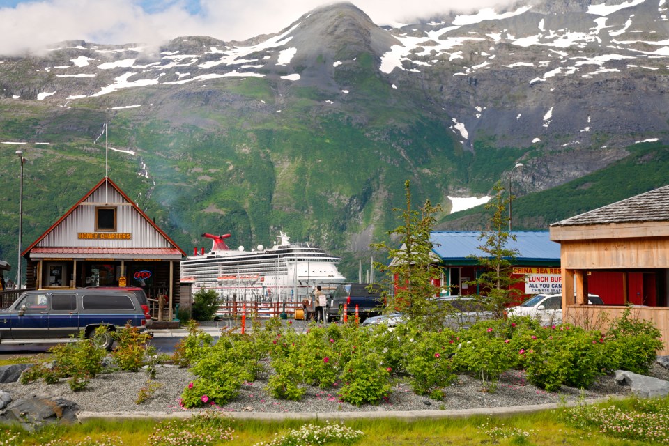 Cruise ship in Whittier, Alaska, with mountains in the background.