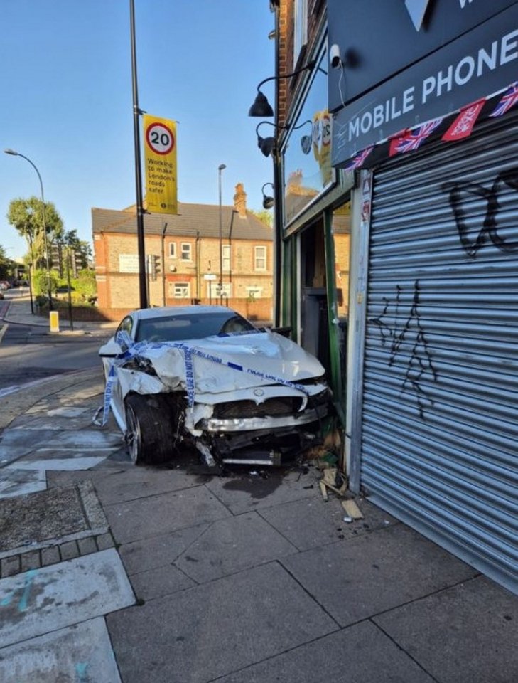 A BMW that lost control at the junction with the A205 South Circular Road and crashed into a fireplace shop