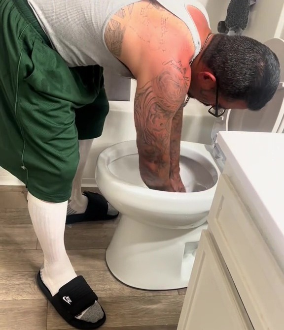 He put the cloth deep into the toilet water before cleaning the floor