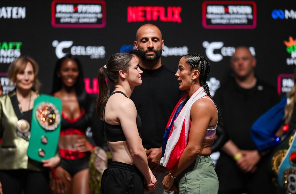 two women standing next to each other in front of a sign that says netflix