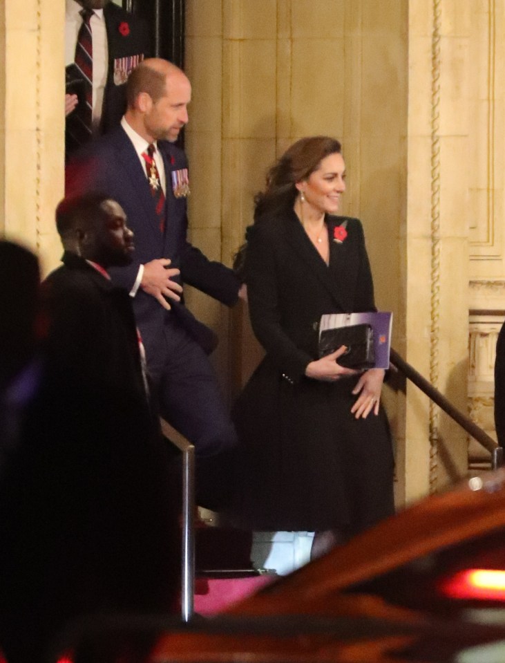 The Prince gently guided Kate out of the venue with a supportive hand on her lower back