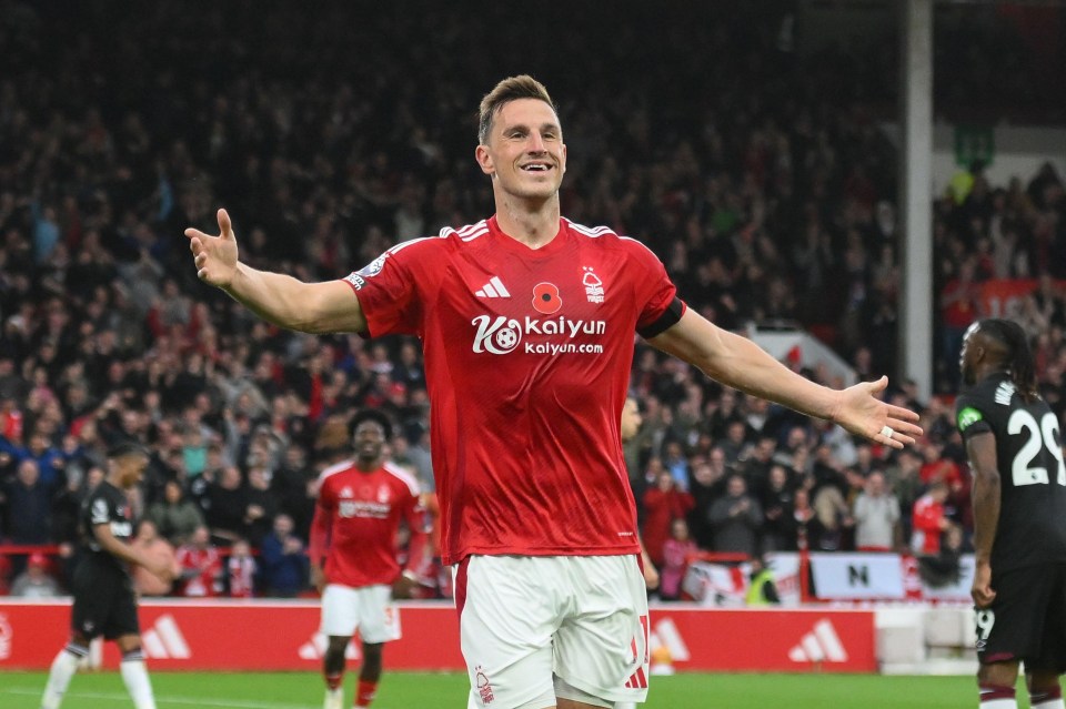 soccer player wearing a red shirt that says kaiyun on it