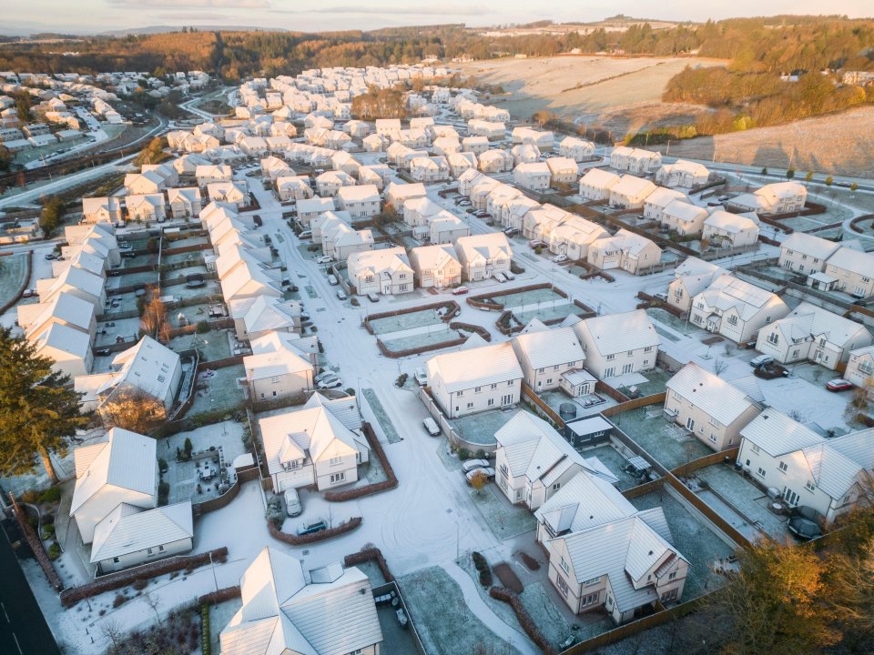 Snowfall drapes a newbuild estate in the suburbs of Aberdeen