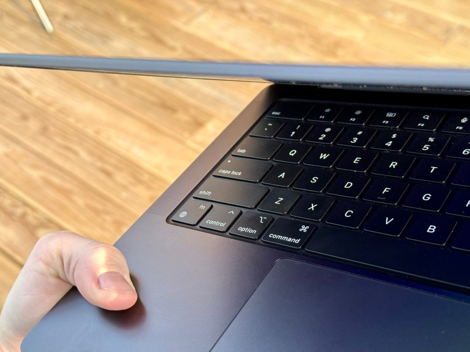 a close up of a laptop keyboard with the option key visible