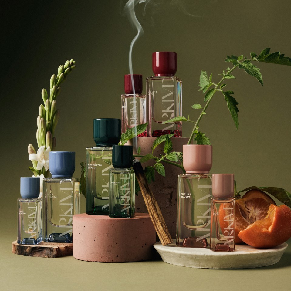 several bottles of perfume are stacked on top of each other