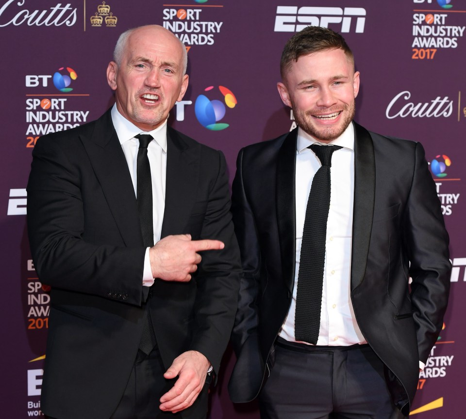 two men on a red carpet at the sport industry awards