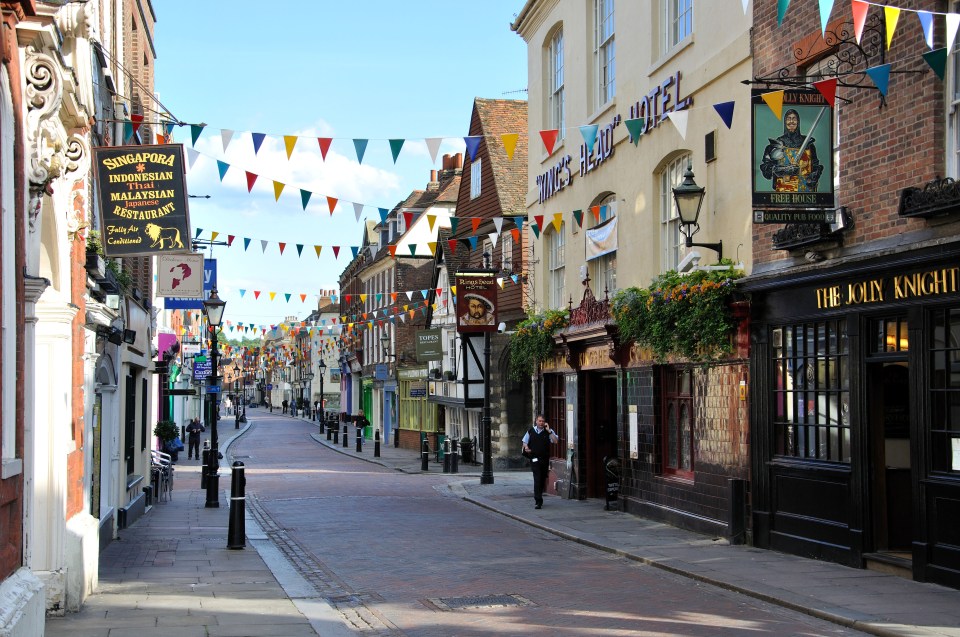 a street with a sign that says the john knight