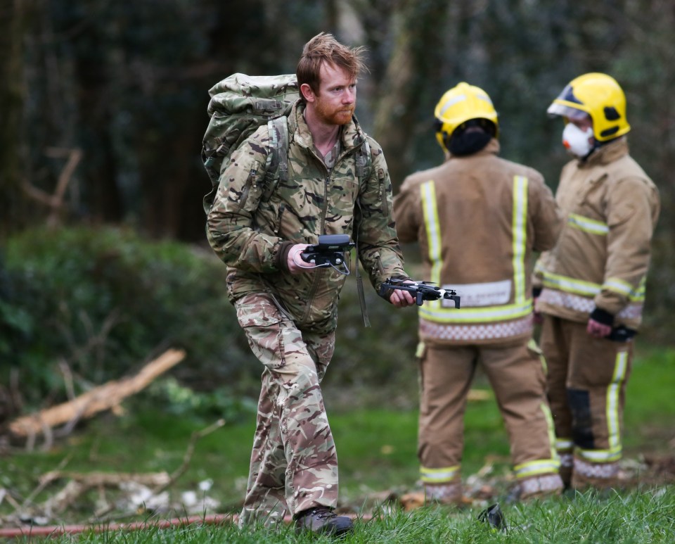 A member of the RAF holding a drone