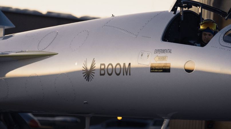 a man sits in the cockpit of a boom airplane