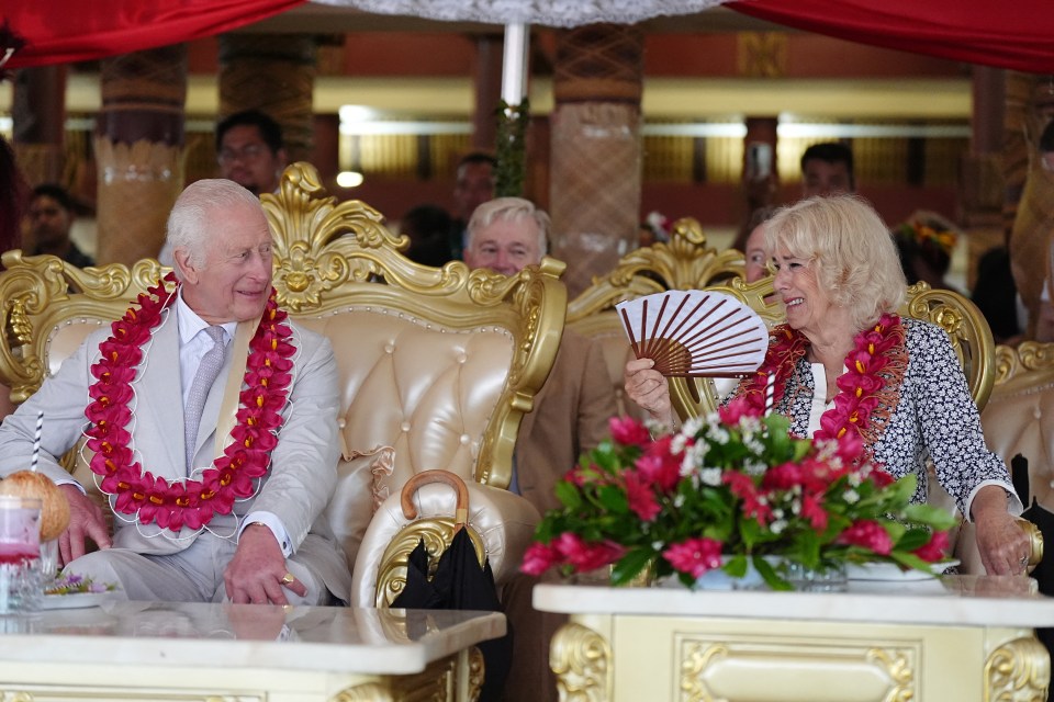 King Charles and Queen Camilla talk during a farewell ceremony, on the final day of the royal visit to Australia and Samoa