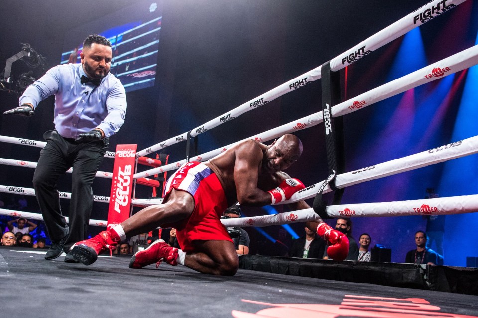 a man in a boxing ring with the word fight written on the ropes