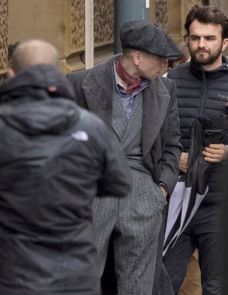 Barry kept a low profile in a flatcap and pinstriped suit