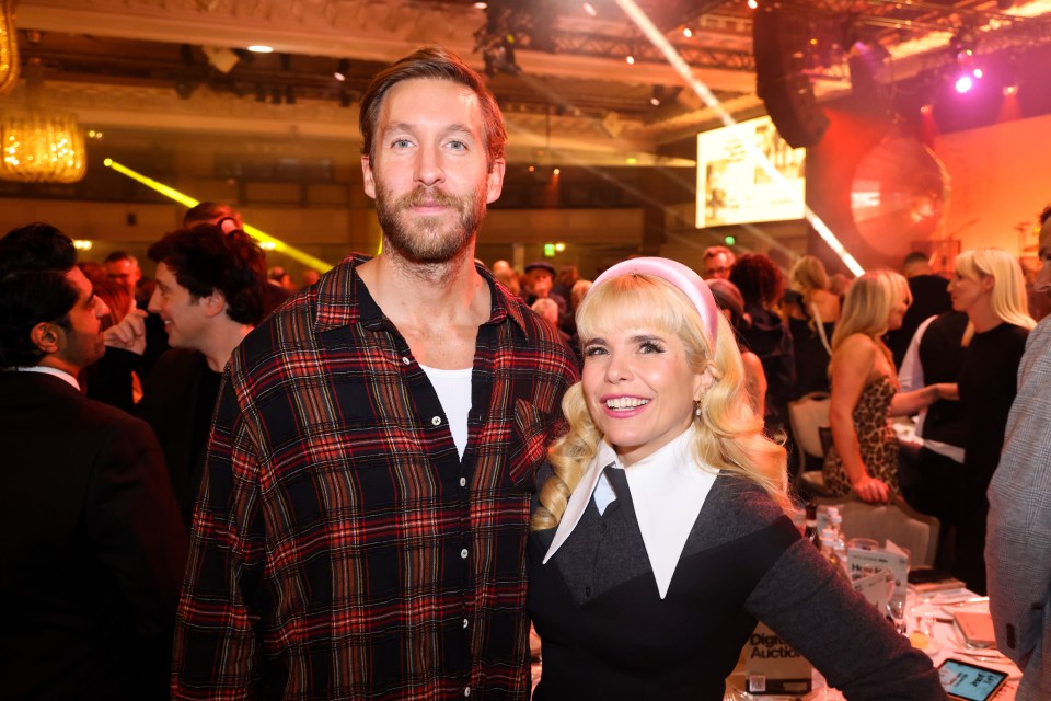 Calvin Harris and Paloma pose for a photo during The Music Industry Trust Awards in London